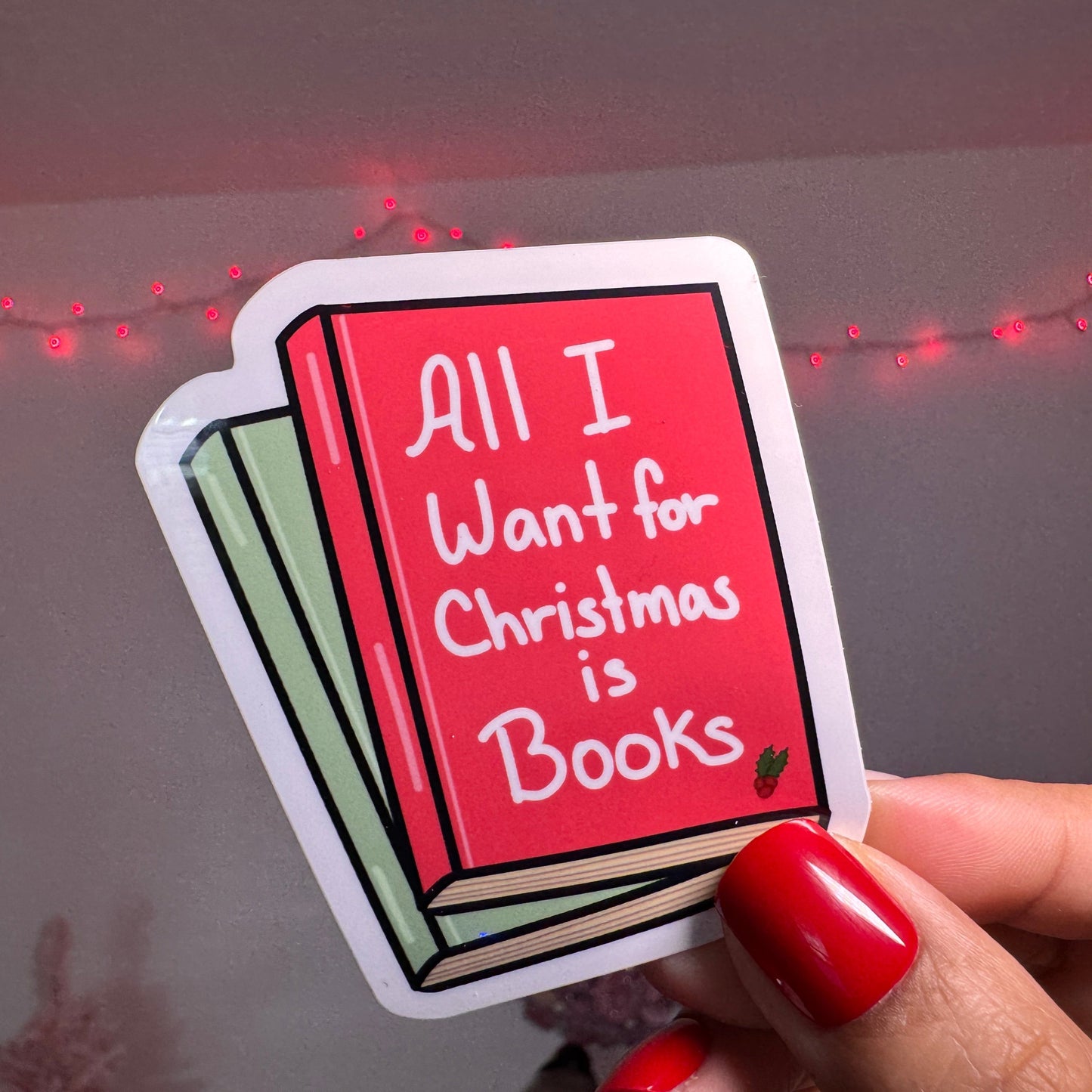 3 inch vinyl, water resistant sticker that says "All I Want for Christmas is Books"