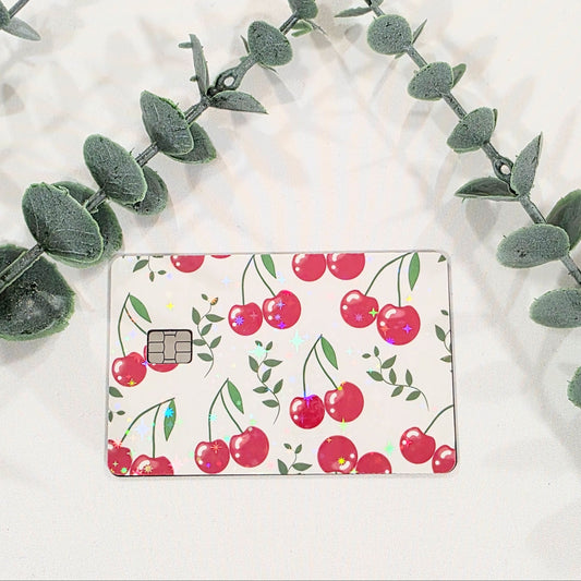 Sticker For card with cherry design on a white background with green leaves