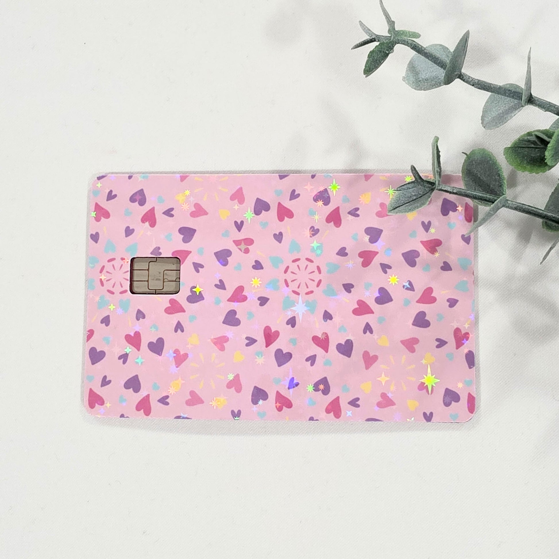 Pink card sticker with hearts on a white background.