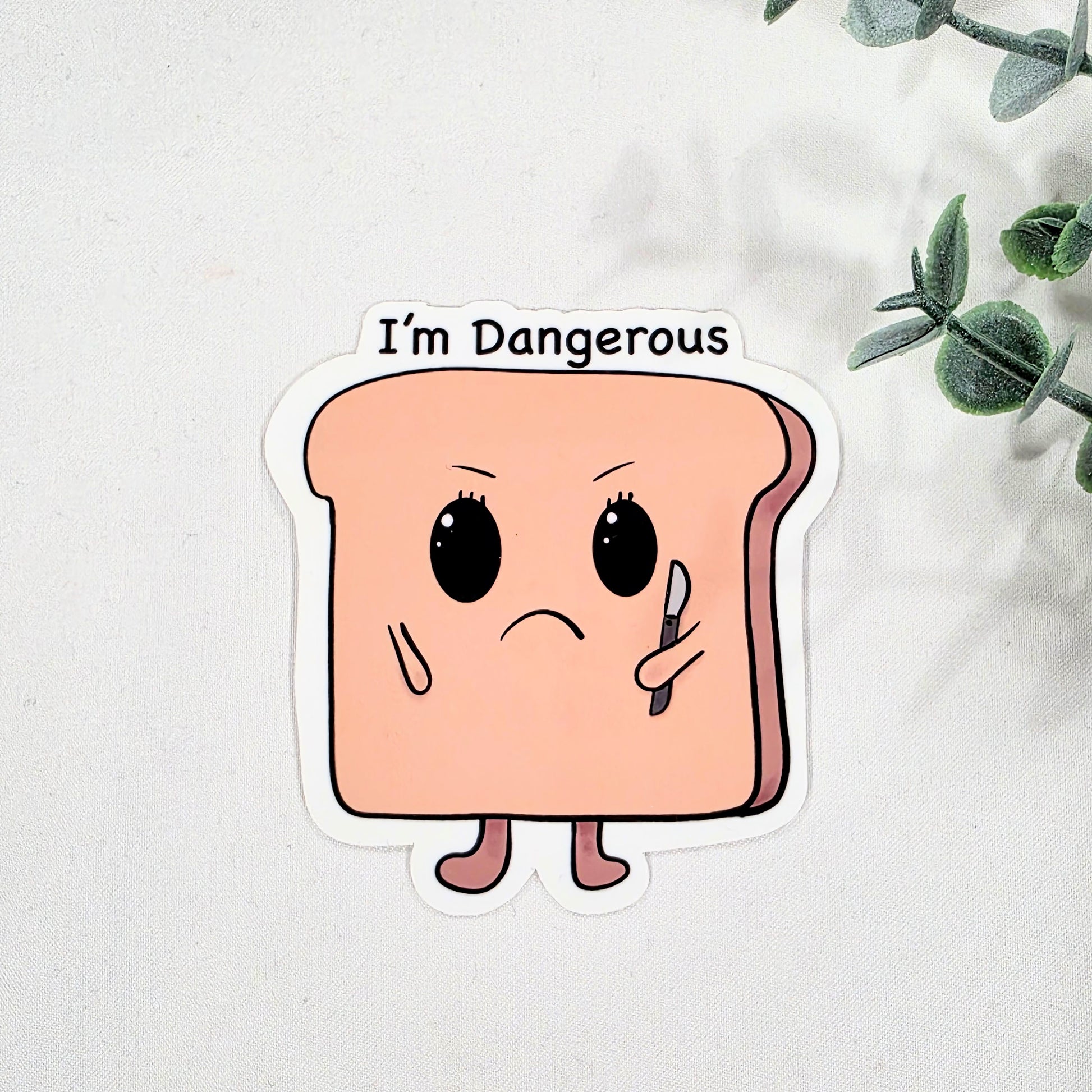 Cartoon toast sticker with 'I'm Dangerous' text on a white background