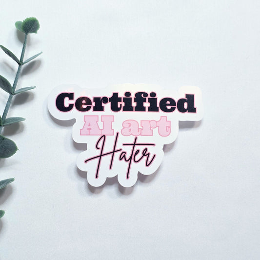Sticker with 'Certified Art Hater' text on a white background with green leaves.