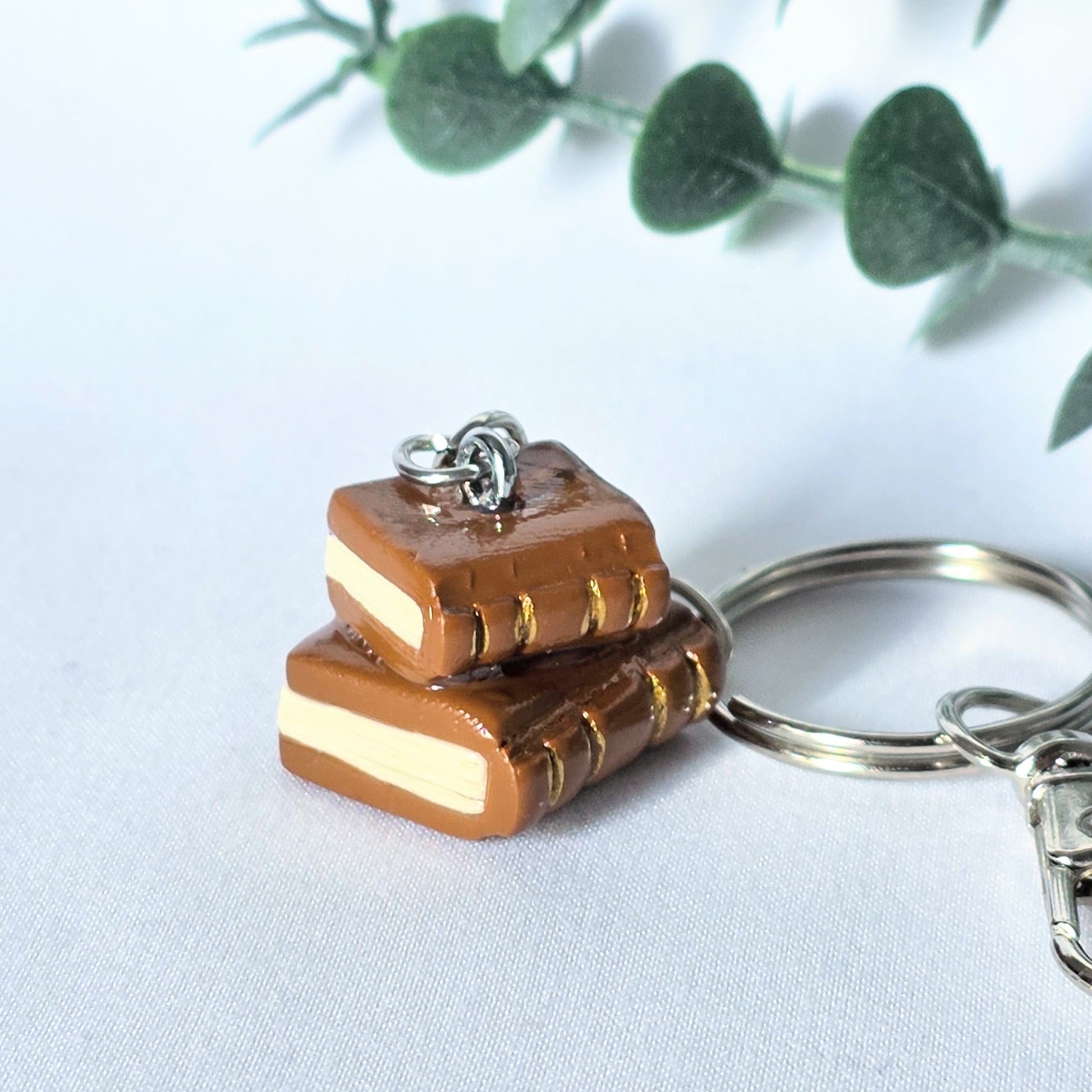 Keychain with book design on a light background