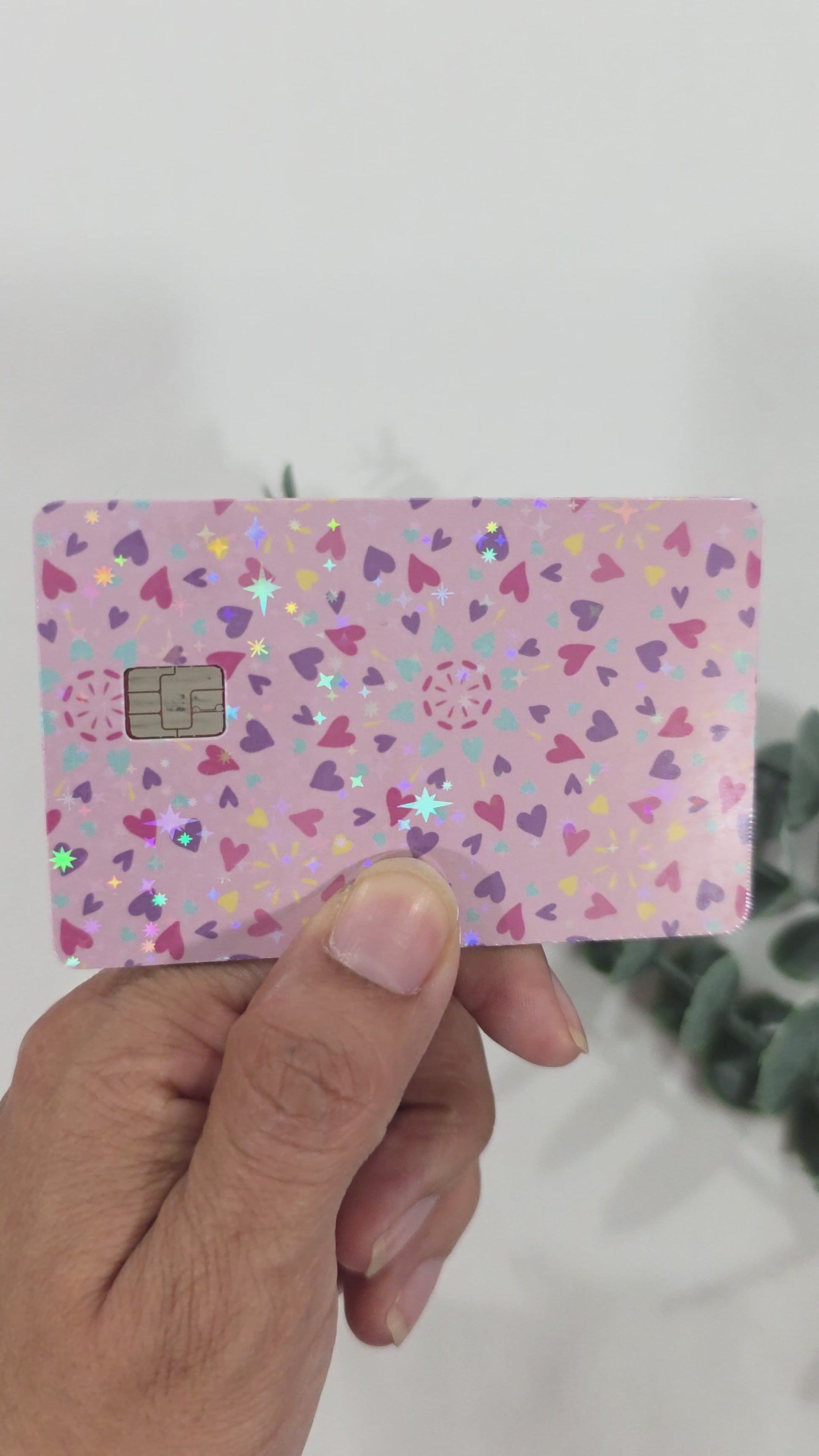 Showing the sparkle of the card sticker by moving it around in the light.