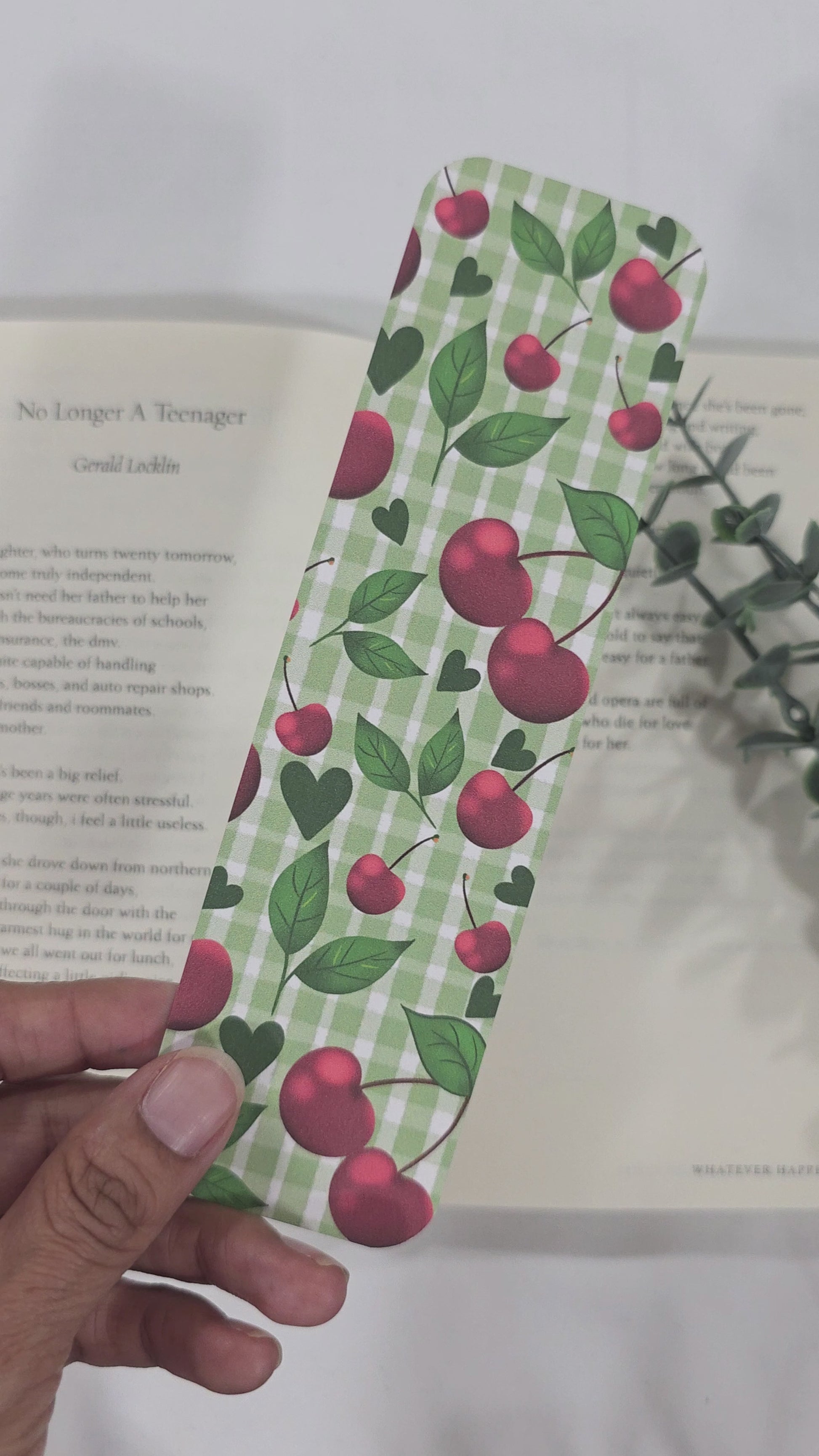 Green gingham bookmark with cherries pattern showing both sides. 